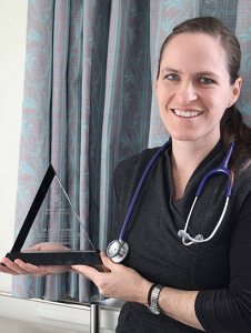 Dr Sheila Cook displays her Award